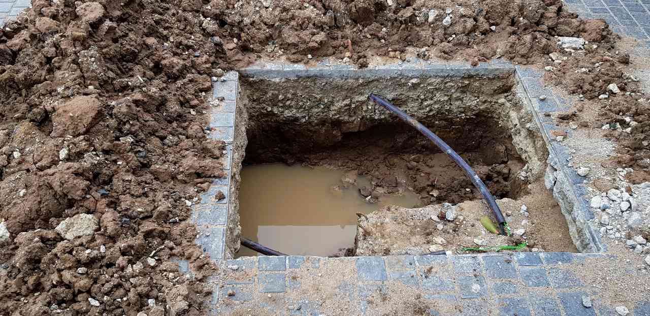 square shape hole with water due to leak
