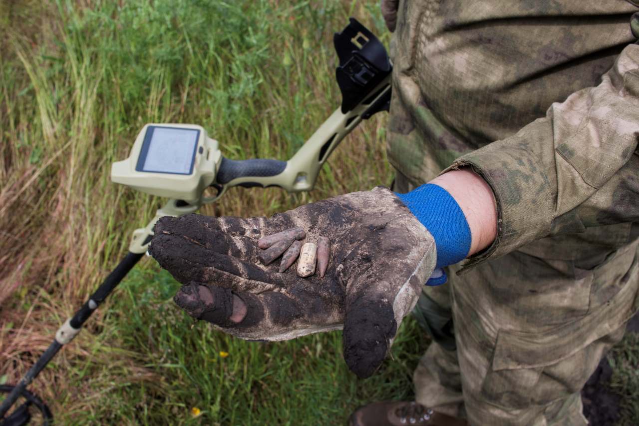 detectorist showing his finds