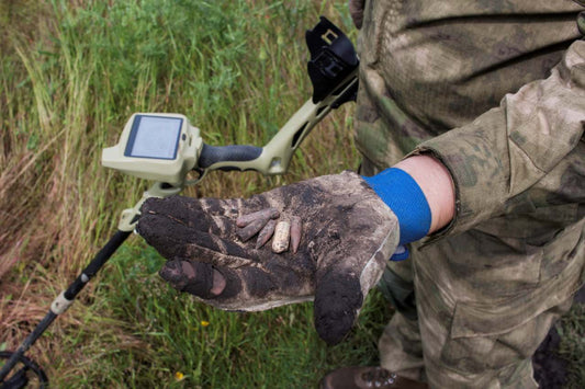 detectorist showing his finds