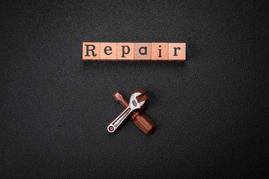 word repair spelled on wooden blocks