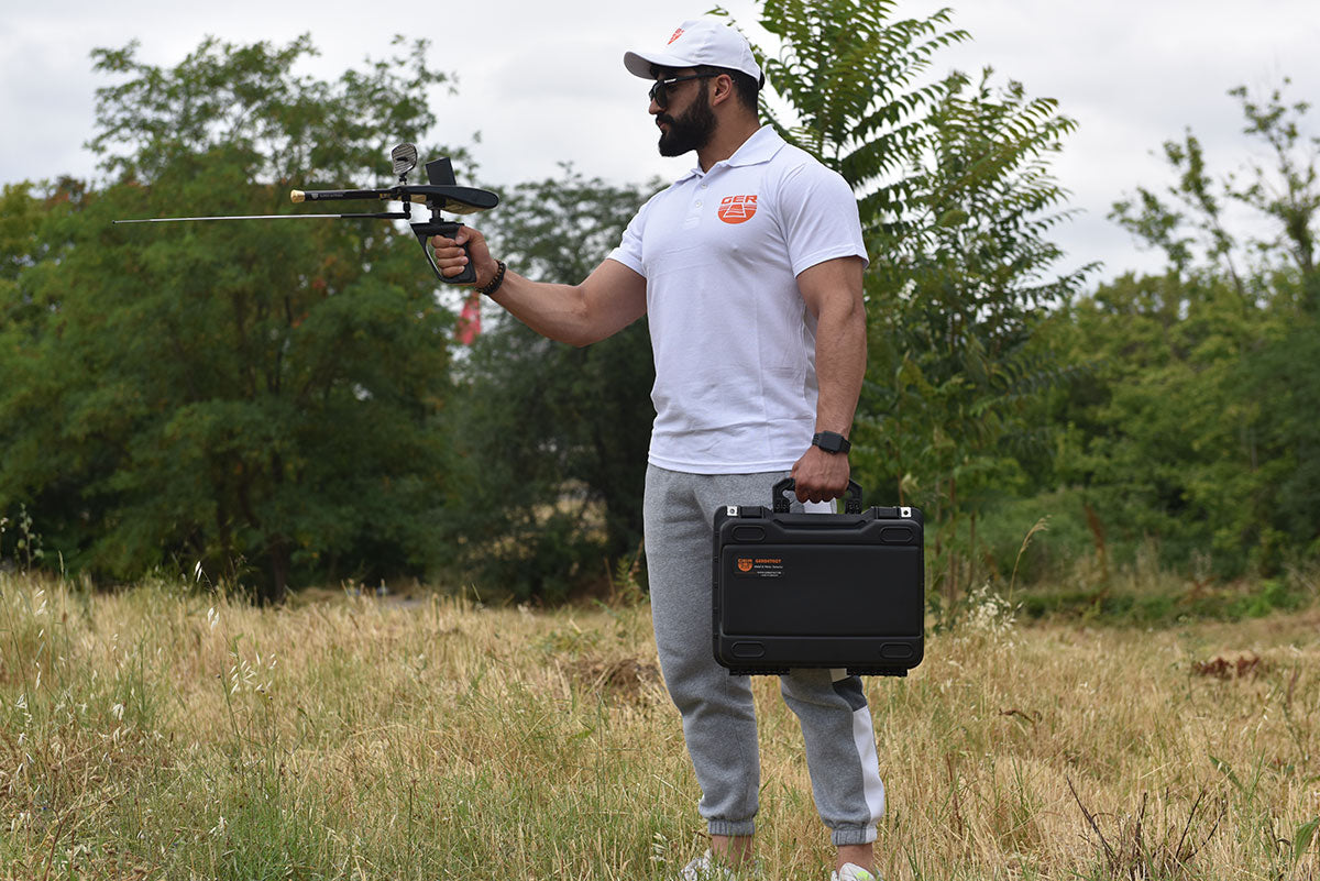 Professional treasure hunter using GER Detect Gold Hunter Smart metal detector in field