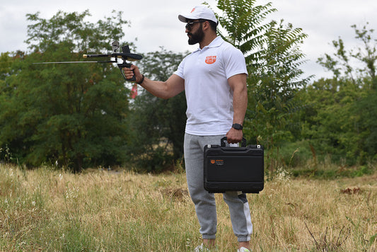 Professional treasure hunter using GER Detect Gold Hunter Smart metal detector in field